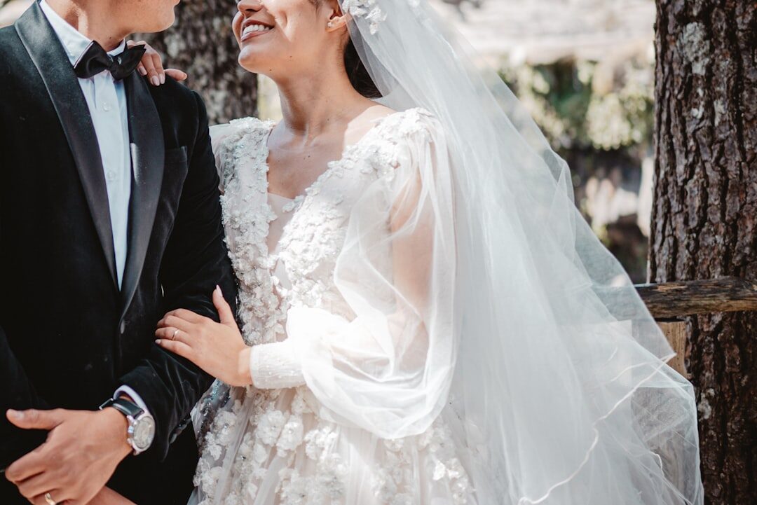 celebrity couple posing at wedding