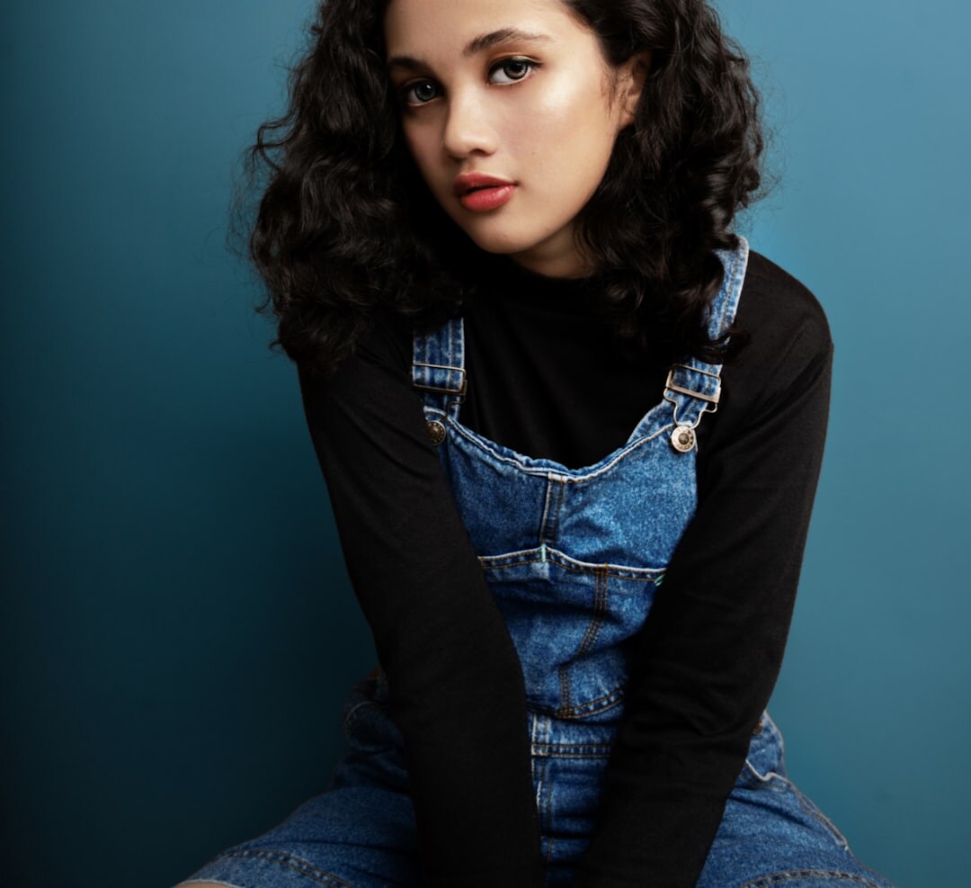 Portrait of a young Latina singer with curly hair