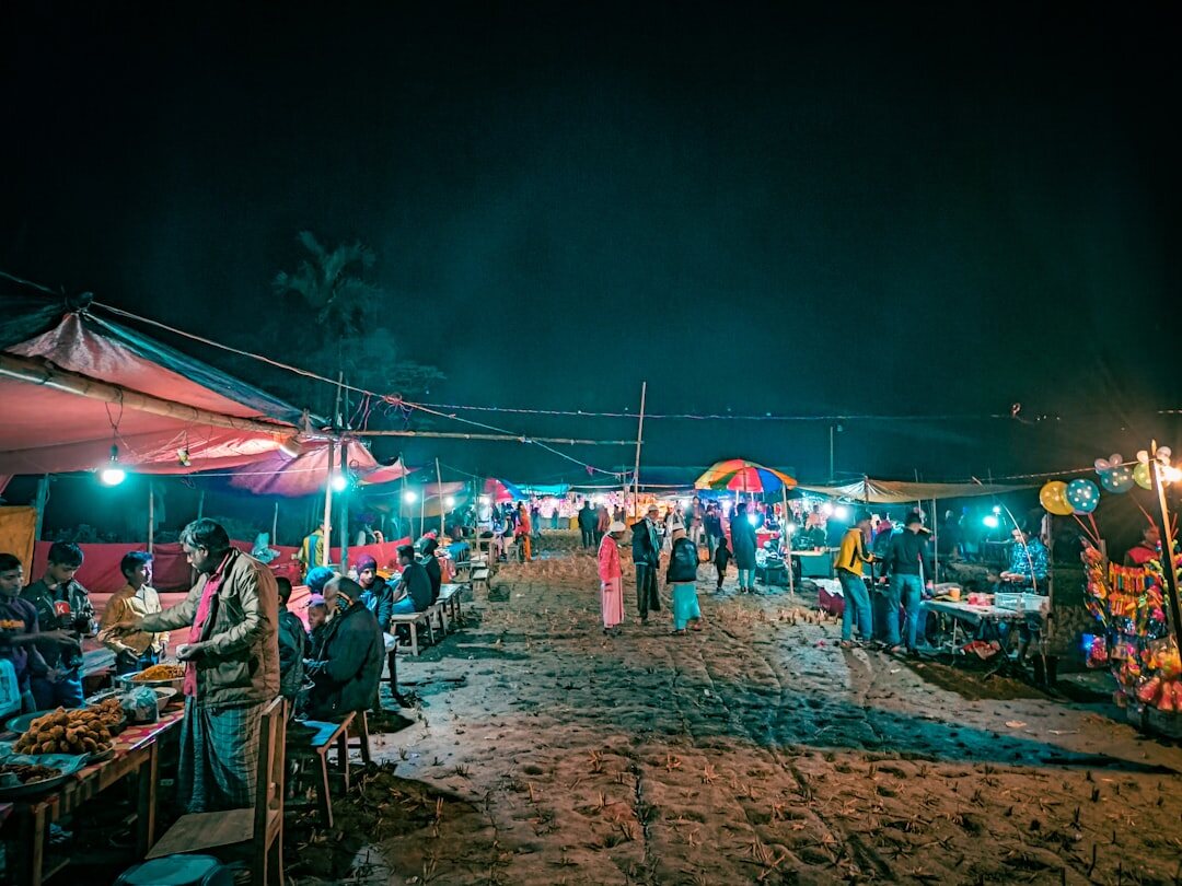 VIP beach party at night with colorful lights